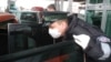 Poland -- Polish border guard wears protective gloves and mask as prevention against the swine flu on his duty at the Polish-Ukrainian border in Dorohusk, 04Nov2009